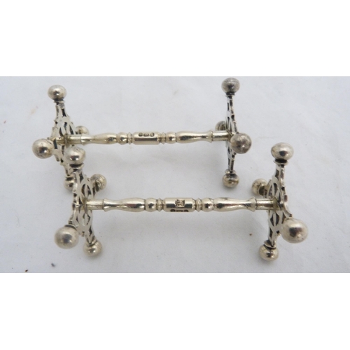 256 - Set of four silver knife rests, 143g gross.