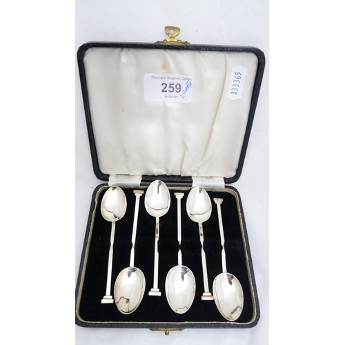 259 - Set of six silver coffee spoons and a set of six silver bean-top coffee spoons, both cased.