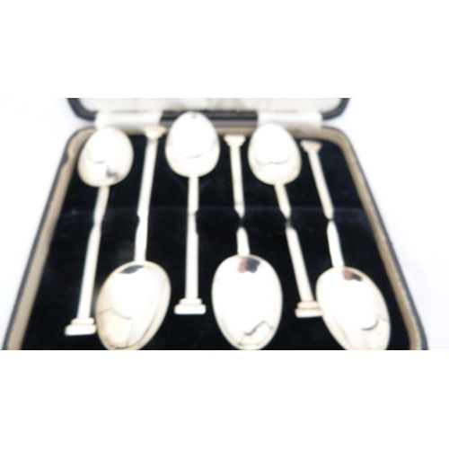 259 - Set of six silver coffee spoons and a set of six silver bean-top coffee spoons, both cased.