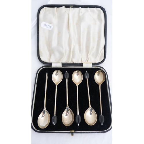 259 - Set of six silver coffee spoons and a set of six silver bean-top coffee spoons, both cased.