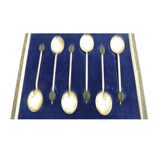 264 - Cased set of six silver coffee spoons with bean terminals, five matching Indian white metal export s... 