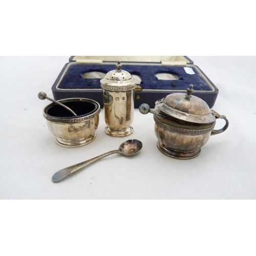 266 - Silver three-piece condiment set by Mappin & Webb, cased, and white metal condiment spoons.