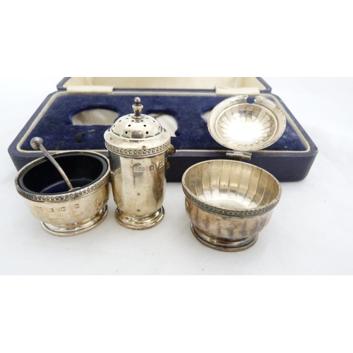 266 - Silver three-piece condiment set by Mappin & Webb, cased, and white metal condiment spoons.