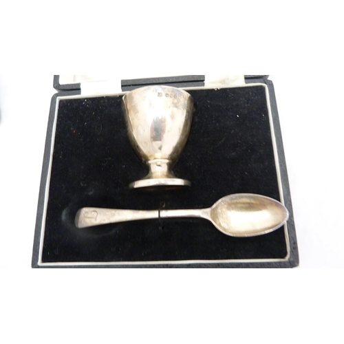 267 - Two boxed silver christening sets, each comprising an egg cup and spoon.