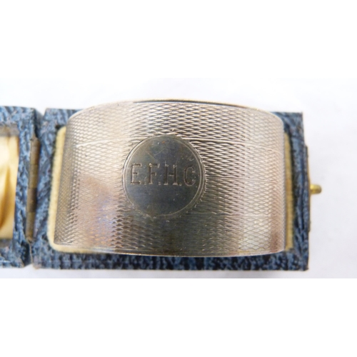 273 - Silver-mounted blotter and a boxed silver engine-turned napkin ring.  (2)