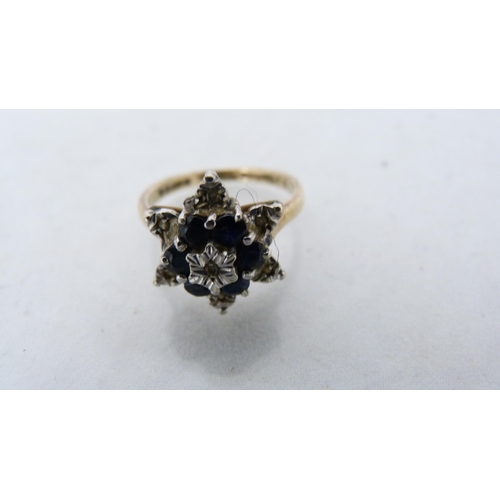 286 - 9ct gold diamond flowerhead cluster ring (3.2g gross) and an unmarked eternity ring.  (2)