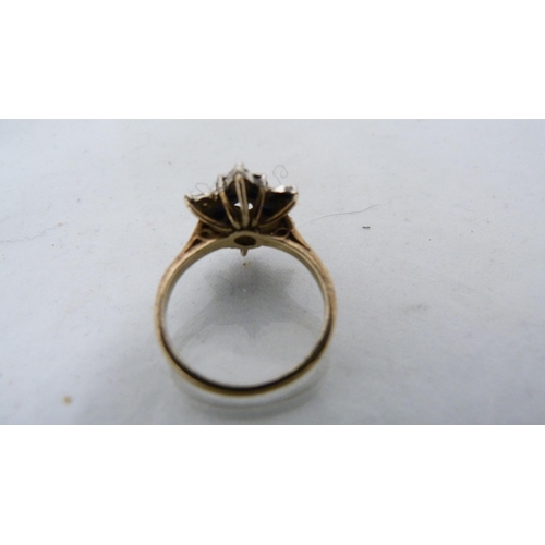 286 - 9ct gold diamond flowerhead cluster ring (3.2g gross) and an unmarked eternity ring.  (2)