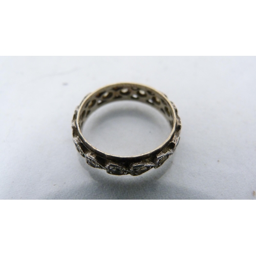 286 - 9ct gold diamond flowerhead cluster ring (3.2g gross) and an unmarked eternity ring.  (2)