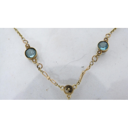 288 - Lady's gold necklace set with aquamarine-style gemstones, stamped 15ct to the clasp, 4.6g gross.