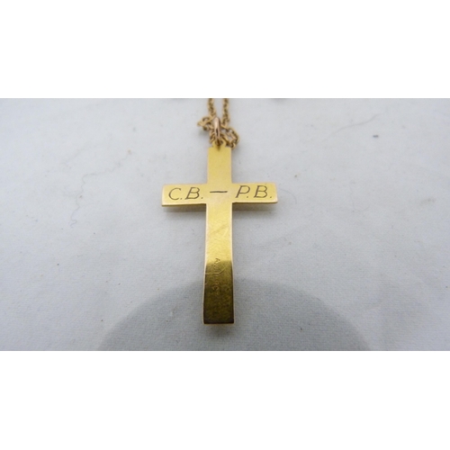 292 - 9ct gold chain (4.2g), with yellow metal cross pendant attached.