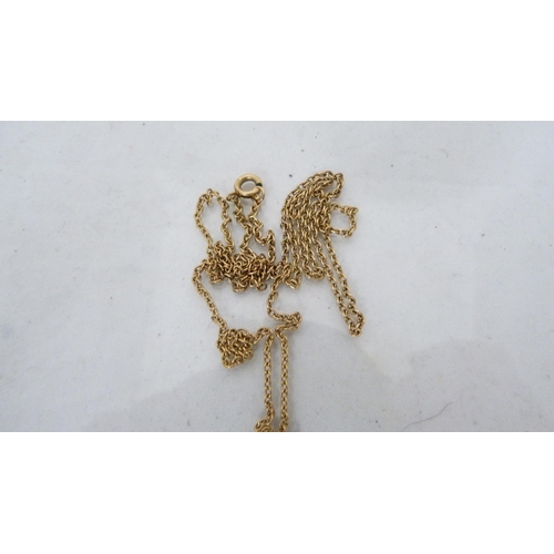 292 - 9ct gold chain (4.2g), with yellow metal cross pendant attached.