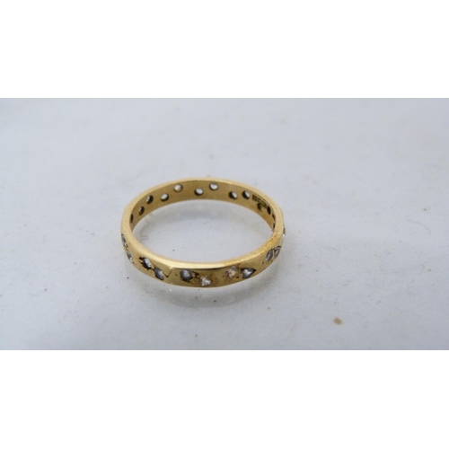 293 - Lady's 18ct gold gem-set eternity ring, 2.3g gross.