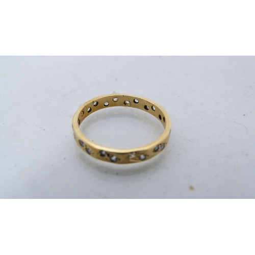 293 - Lady's 18ct gold gem-set eternity ring, 2.3g gross.