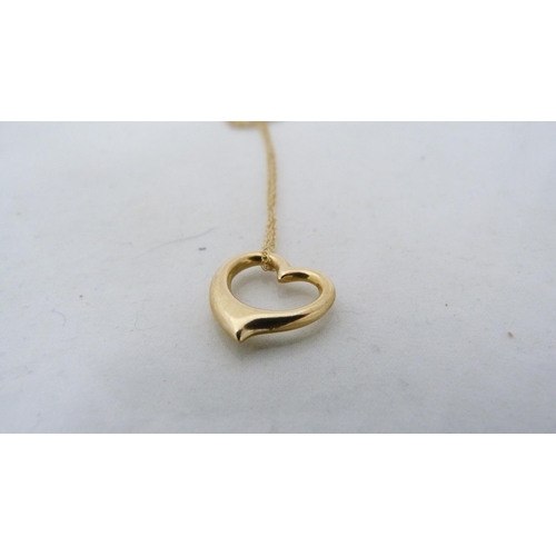 306 - 9ct gold heart-shaped pendant on chain and a 9ct gold chain with similar unmarked pendant, gold cont... 