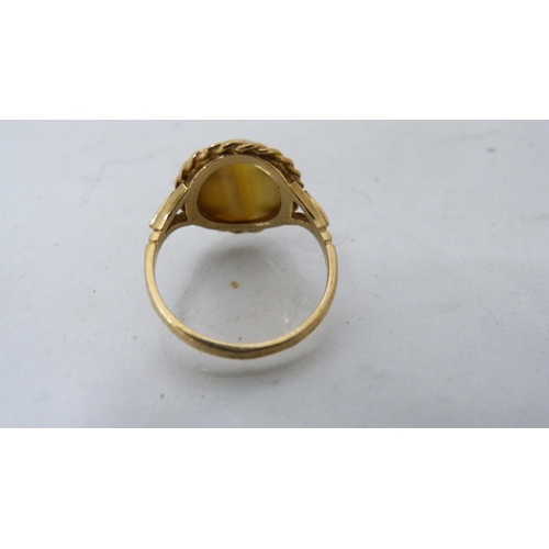 309 - 9ct gold lady's tiger's eye-style agate ring, 3.1g gross.