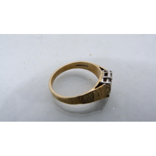 310 - Lady's gold and diamond-set ring, stamped indistinctly, 2.5g gross.