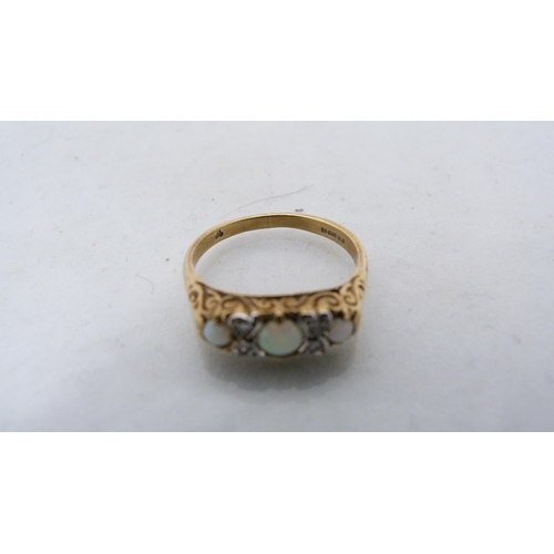 311 - Two 9ct gold opal rings, 3.7g gross.