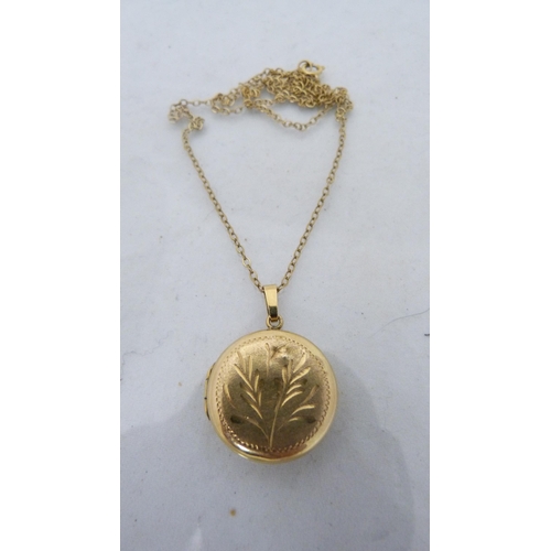 312 - 9ct gold chain (approximately 1.3g), with yellow metal locket.