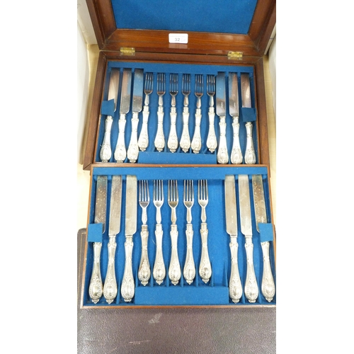 32 - Set of twelve EP-handled fruit knives and forks in a mahogany case, and another cased set of six EP-... 