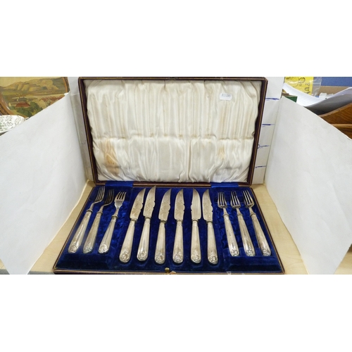 32 - Set of twelve EP-handled fruit knives and forks in a mahogany case, and another cased set of six EP-... 