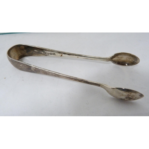 320 - Georgian Scottish silver teaspoon, stamped WR, pair of silver sugar tongs and a silver florin, 58g g... 