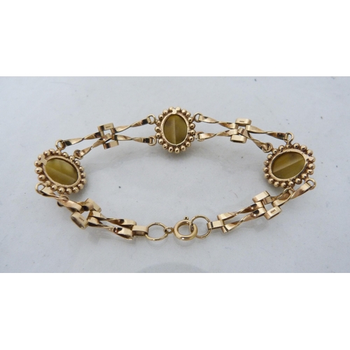 325 - 9ct gold lady's tiger's eye-style agate bracelet, 12.7g gross.