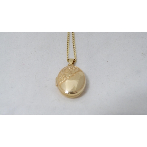 331 - 9ct gold chain (1.7g gross), and a locket attached.