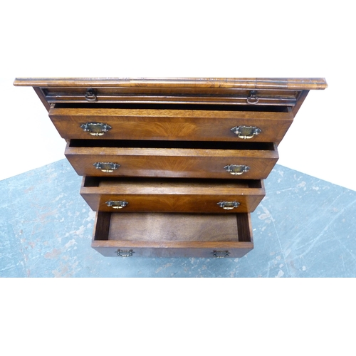 365 - Small walnut chest of four drawers, with brushing slide.