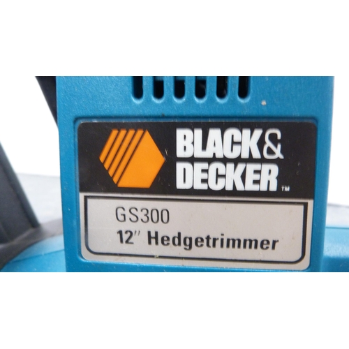 371 - Black & Decker strimmer, Black & Decker hedge cutters and an extension cable.