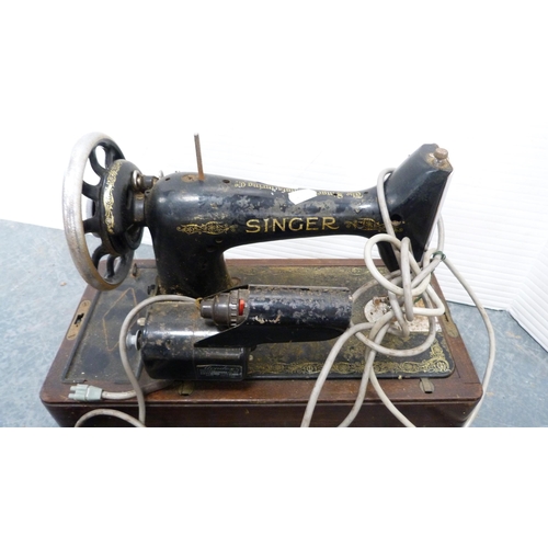 373 - Singer portable sewing machine and a Winfield portable sewing machine, with accessories.  (2)