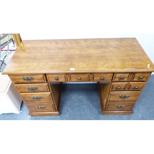 399 - Victorian-style walnut kneehole desk and a similar swivel ladder-back desk chair.  (2)