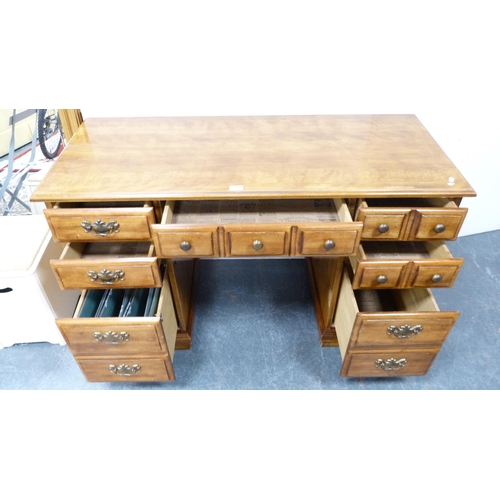 399 - Victorian-style walnut kneehole desk and a similar swivel ladder-back desk chair.  (2)