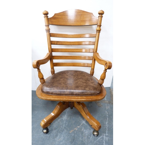 399 - Victorian-style walnut kneehole desk and a similar swivel ladder-back desk chair.  (2)