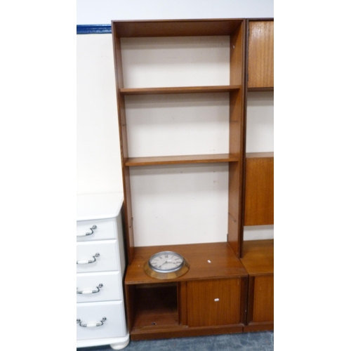 404 - G Plan retro teak modular wall unit with shelves and cupboards in sections and a wall clock.