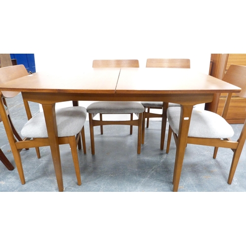 408 - Retro teak dining table with additional leaf and six matching dining chairs.  (7)