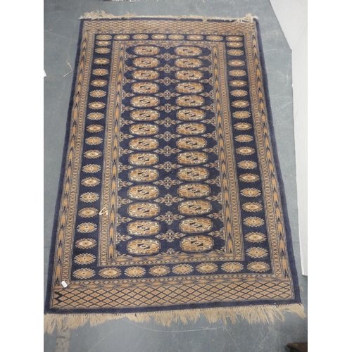 419 - Turkish-style Bokhara rug on blue ground and a smaller example.  (2)