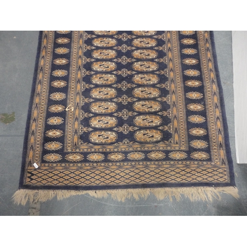 419 - Turkish-style Bokhara rug on blue ground and a smaller example.  (2)