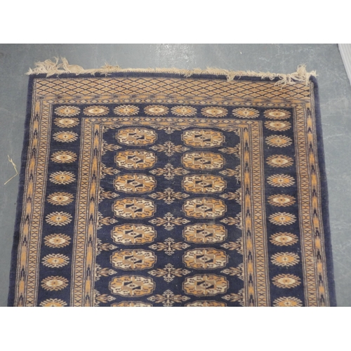 419 - Turkish-style Bokhara rug on blue ground and a smaller example.  (2)