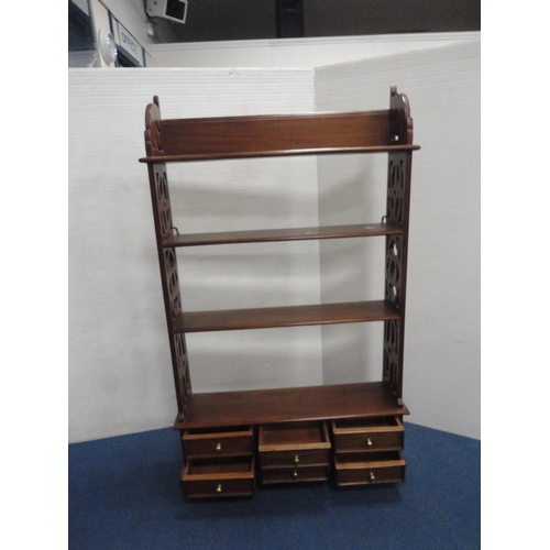 425 - Reproduction Victorian-style mahogany hanging shelves with drawers below.