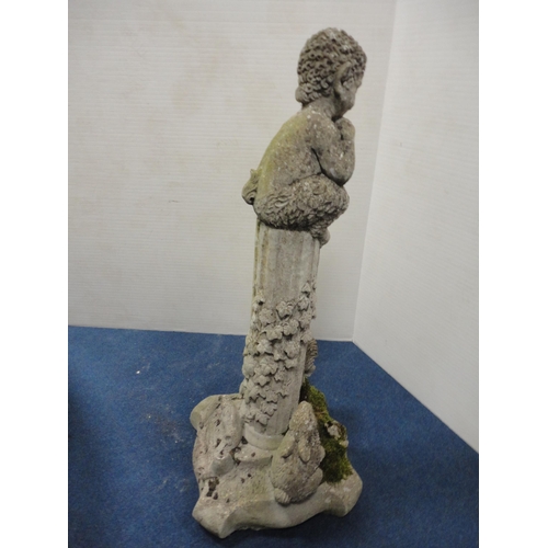 433 - Stone garden figure in the form of a mythical child seated on a fluted stand with applied rabbits an... 