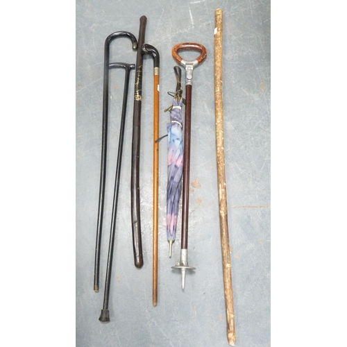 66 - Group of walking sticks, umbrella and a shooting stick.