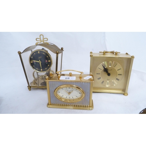 88 - Three carriage-type mantel clocks to include examples by Ingersoll and Churchill, also assorted bird... 