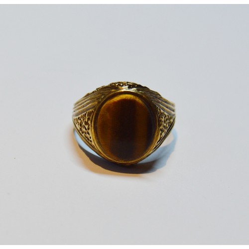 143 - 9ct gold ring with tiger's eye, size S, 5.7g gross.