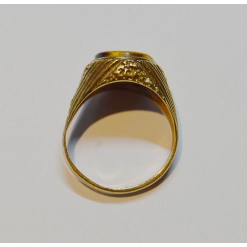 143 - 9ct gold ring with tiger's eye, size S, 5.7g gross.