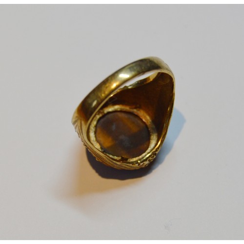 143 - 9ct gold ring with tiger's eye, size S, 5.7g gross.