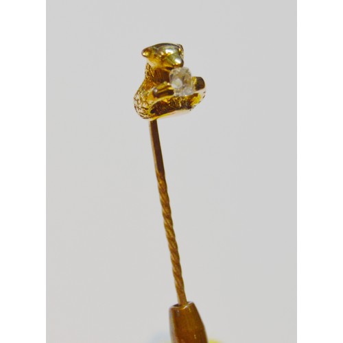 144 - Victorian gold scarf pin modelled as a bear gripping an old-cut diamond, probably 15ct, 5.2g gross.