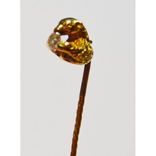 144 - Victorian gold scarf pin modelled as a bear gripping an old-cut diamond, probably 15ct, 5.2g gross.