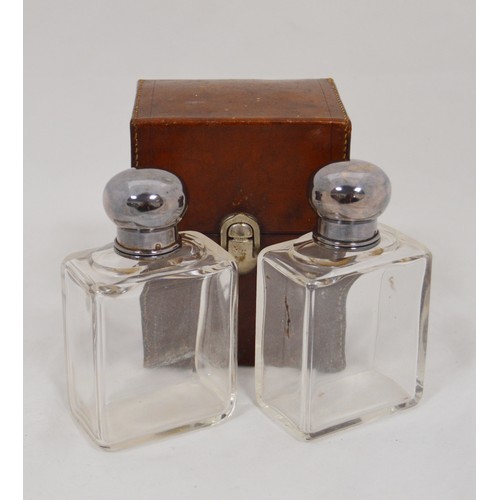 59 - Pair of French cut glass spirits bottles with silver mounts, in leather carrying case, 'Hall du Voya... 