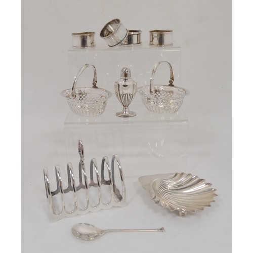 62 - Silver butter shell, a silver toast rack, various silver and an EP napkin ring, 390g gross.