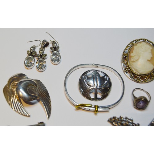 151 - Two early 19th century paste brooches, various silver jewellery and a wristwatch.